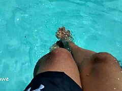 feet splashing playfully in pool with lots of water