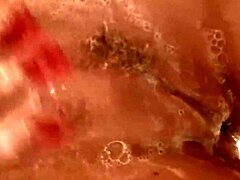 Nikki Benz soaps up her natural tits, oh gosh it's so slippery and fun... wait, big clit too?