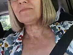 Naughty housewife takes a selfie with her tits exposed while flashing in the car during homemade amateur fun