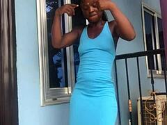 A crazy girl twerks wildly on the outdoor balcony