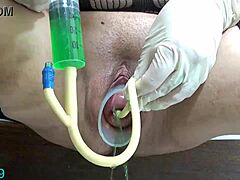 Extreme Asian mommy stretches with bottles in bdsm prolapse action, hanging from uterus! 😱🍾