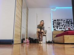 The blonde model showcases high heels in the glamorous fashion show, highlighting her short hair and feet with socks.