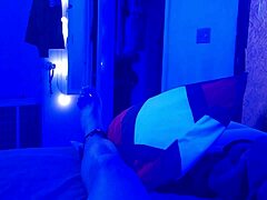 under the blacklight, this chick with black feet gives an intense footjob, sucking on toes and all that fetish stuff
