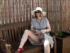 What happens when a naughty housewife strips naked in her garden for some outdoor fun?