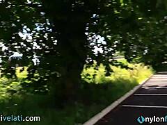 Brunette In Black Pantyhose Shows Off Her Feet From Her Car In Public