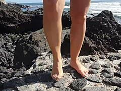 I enjoy foot fetish with my seductive stepmom flashing her huge tits and ass on the public beach.