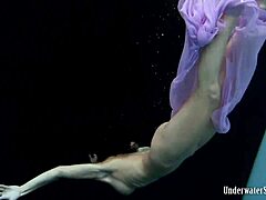 Aneta shows big tits in purple dress underwater in pool