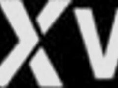 Pretty brunette college student relaxes on the sofa.