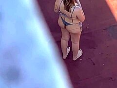 Neighbors sunbathing in bikinis on the terrace