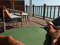 Hot babe gives sloppy handjob on rooftop!